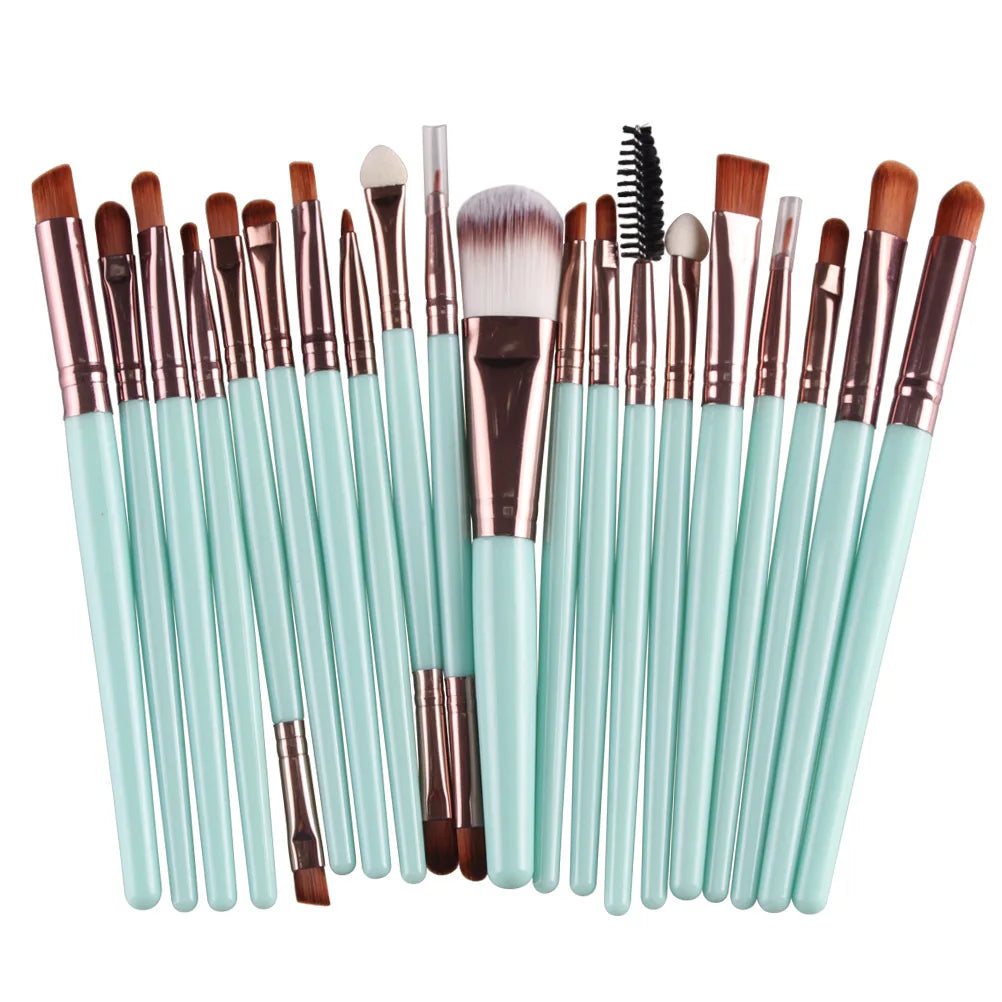 A collection of 20 professional makeup brushes in various sizes and shades arranged horizontally.