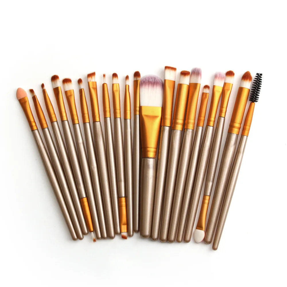 A collection of 20 professional makeup brushes with various sizes and colors arranged diagonally on a white background.