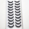 A plastic tray containing multiple pairs of natural mink false eyelashes for cosmetic use.