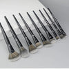 A set of professional makeup brushes for contouring and highlighting, shown lined up on a white surface.