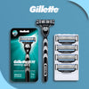 Gillette Mach3 manual razor with replacement blades and a white travel case shown in various views