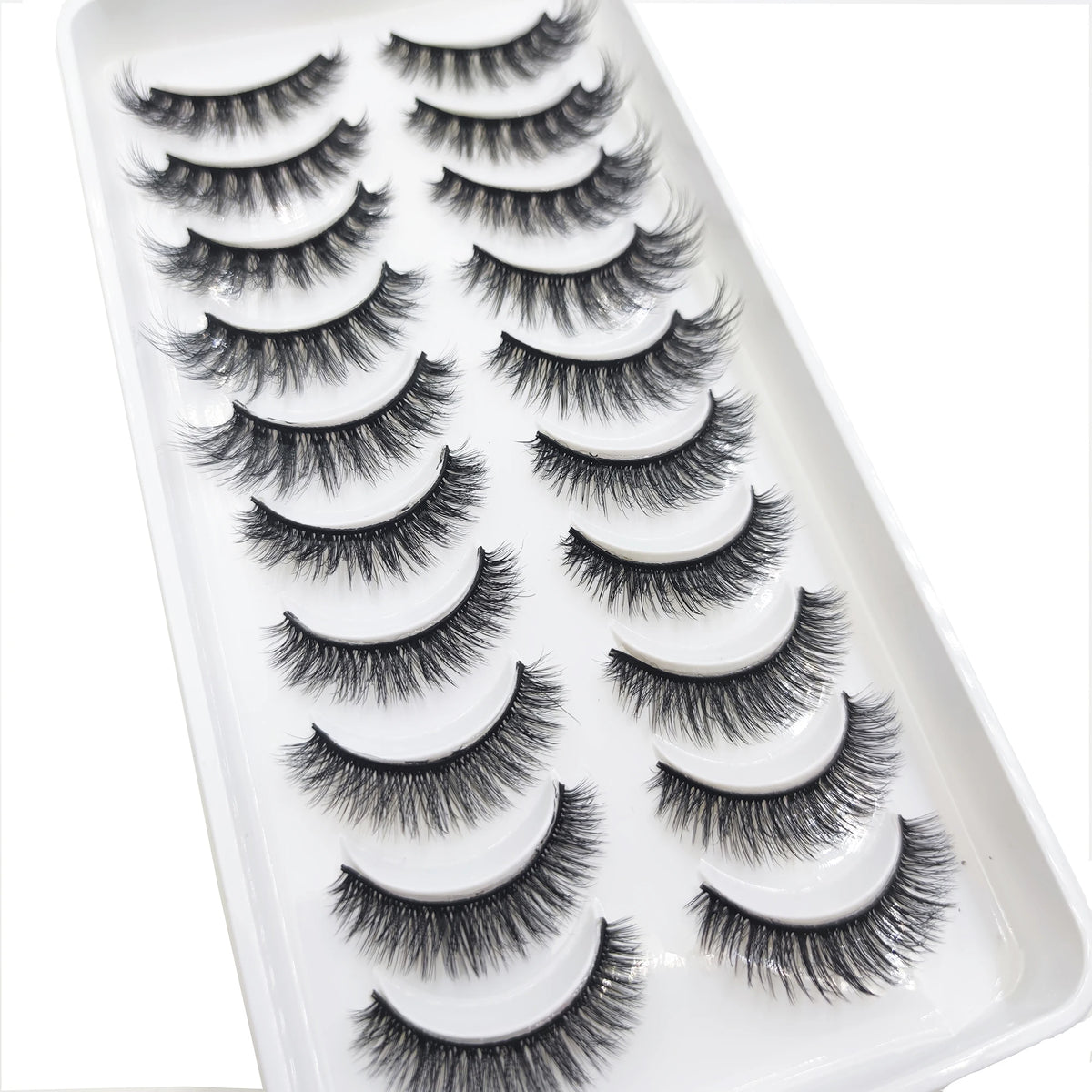A tray of natural 3D mink false eyelashes displayed for cosmetic use.