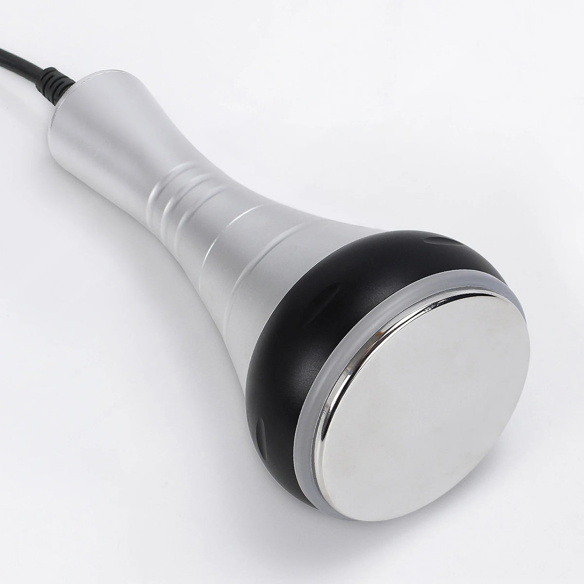 A silver and black ultrasonic body sculpting massager with a cord.