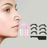 A close-up of a woman's nose showing an ergonomic nose lifting and shaping clip set for nasal contouring.