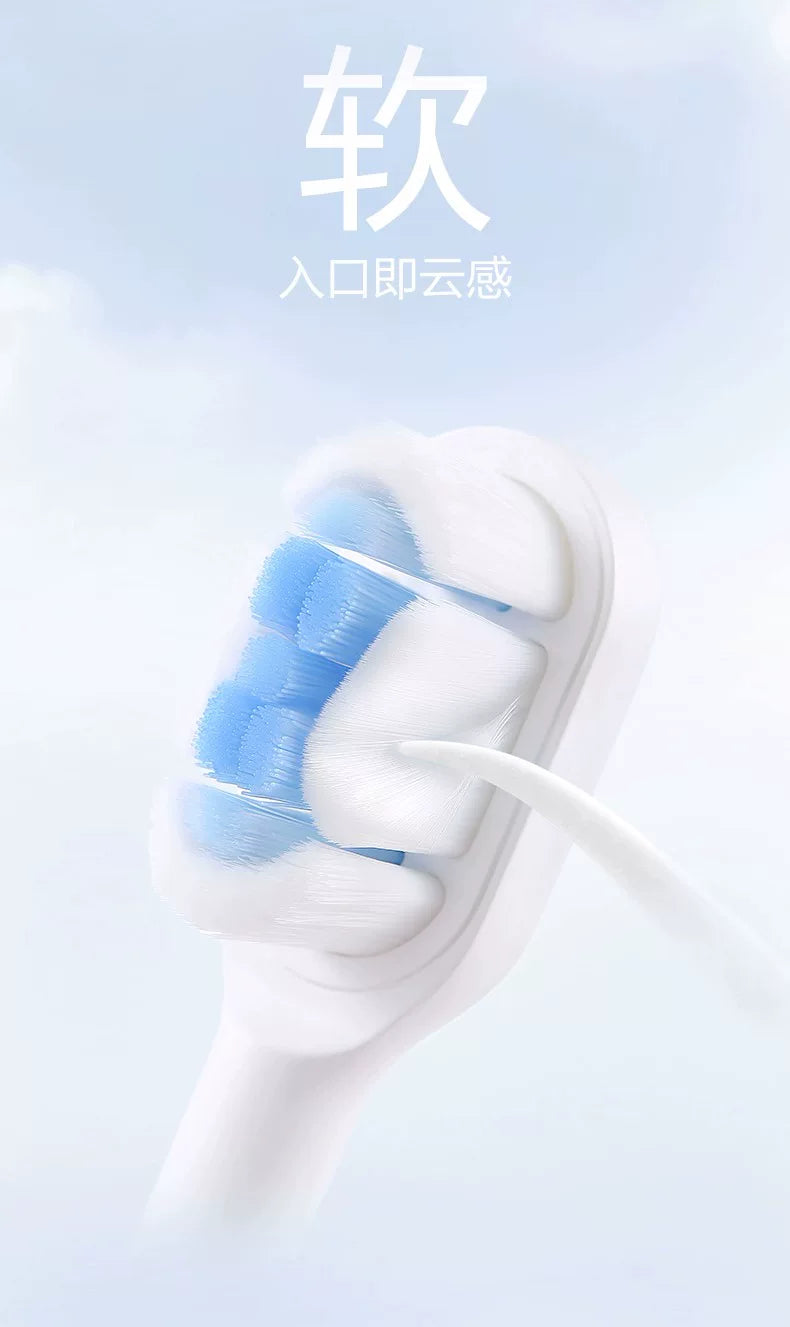 A close-up view of a white replacement brush head for a sonic toothbrush, showing blue bristles.