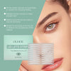 Close-up of an eye showing the application of adhesive eyelid lift strips for a natural double fold