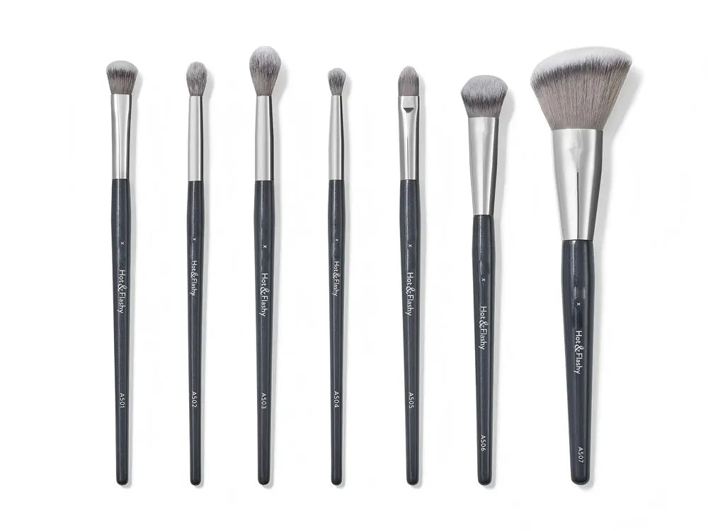 A set of multi-use makeup brushes for sculpting and application, shown standing vertically.