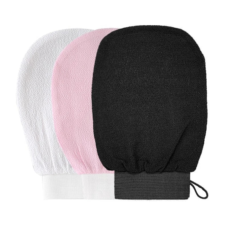 A set of three exfoliating body scrubbing gloves in white, pink, and black.