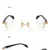 A pair of gold-accented retro frameless reading glasses shown from the front and side views.