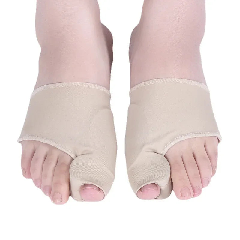 A pair of beige orthopedic toe separator and corrector set for feet.