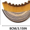 A wooden face brush with a golden-yellow bristles, measuring 8cm long and 6cm wide.