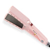 A pink professional titanium hair straightener with a dark plate and control panel.
