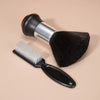 A black hair styling brush with a silver handle and a separate white brush is shown on a light background.