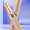 A close-up of a gold-colored fine shaving curved blade head for hair removal.