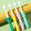 A set of five cartoon dinosaur toothbrushes in various colors, including green, yellow, pink, and light blue.