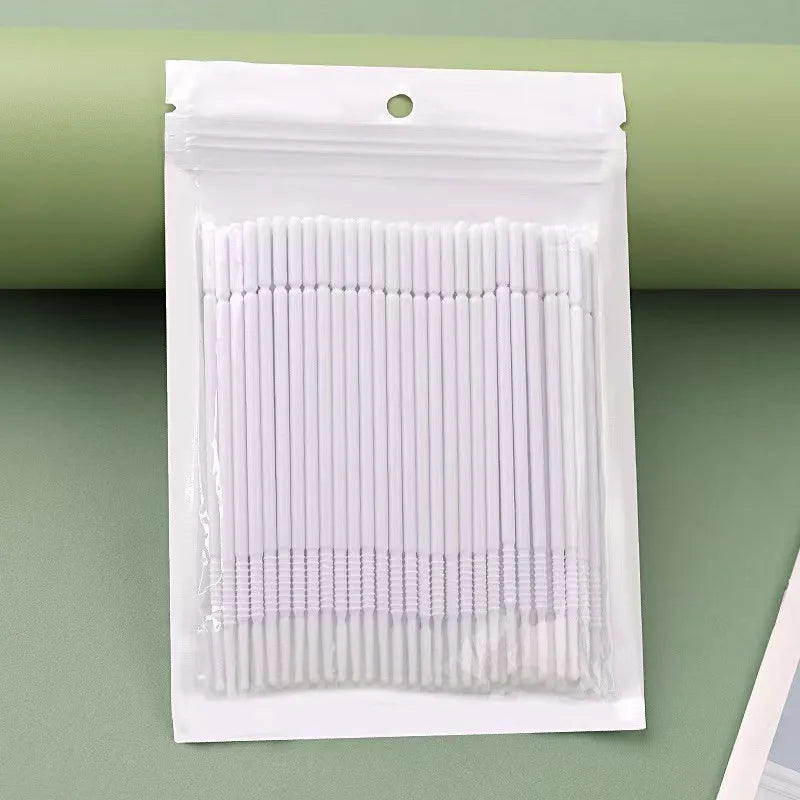 A package of bulk eyelash extension cleaning swabs in white.