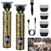 A set of vintage rechargeable hair clippers and trimmers with gold accents shown alongside various grooming tools.