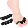 Black silicone toe separators placed on a foot for foot and bunion relief.