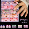 A set of 240 press-on nails in various shades of pink, green, and purple displayed on a clear plastic tray.