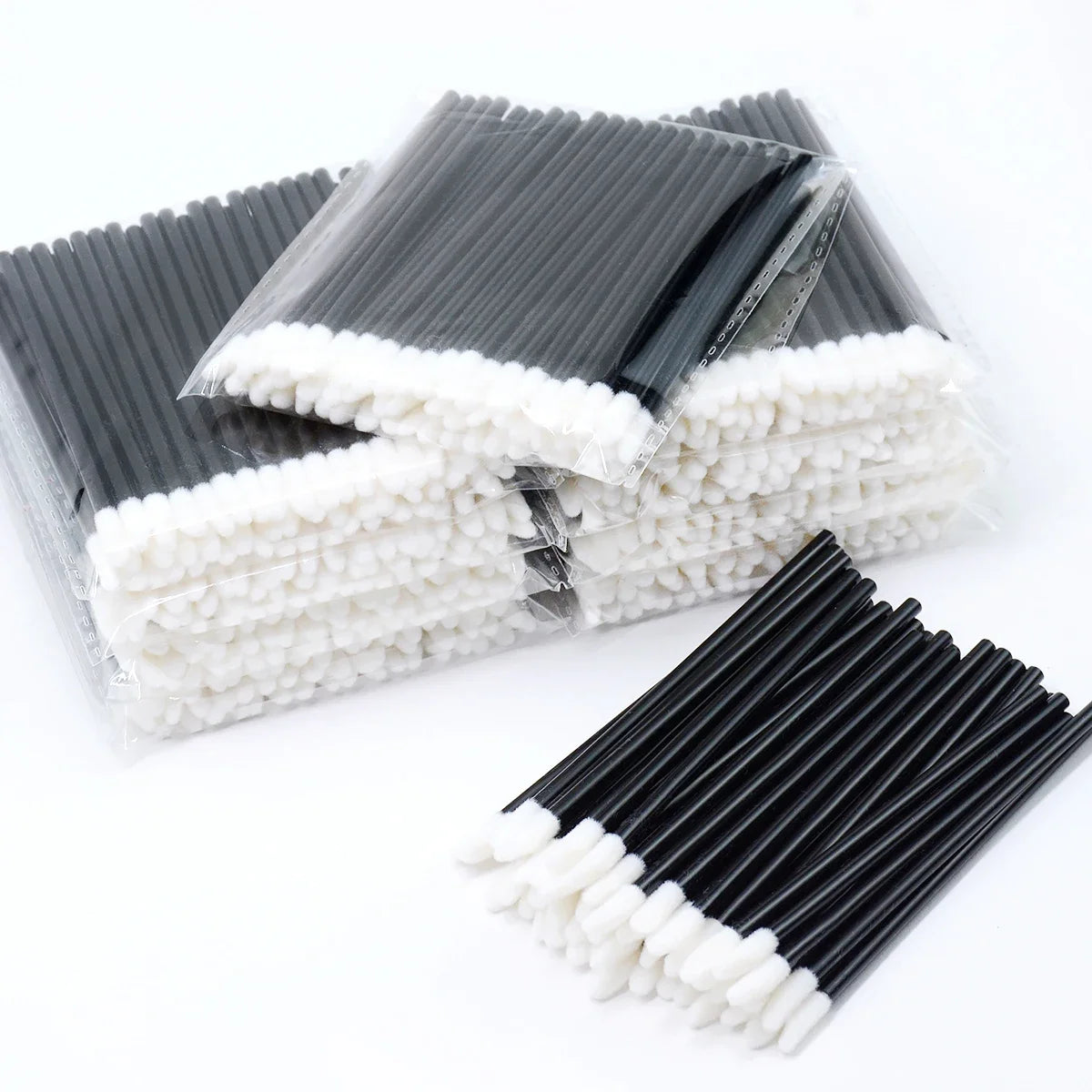 Pack of disposable lip wands with black and white bristles for gloss and lipstick application