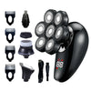 A collection of grooming tools including electric shavers, trimmers, and various attachments in black.