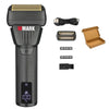 A black professional rotary hair trimmer with a gold guard, blades, and accessories displayed next to the main unit.