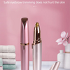 A pink electric eyebrow trimmer and epilator device displayed on a white surface.
