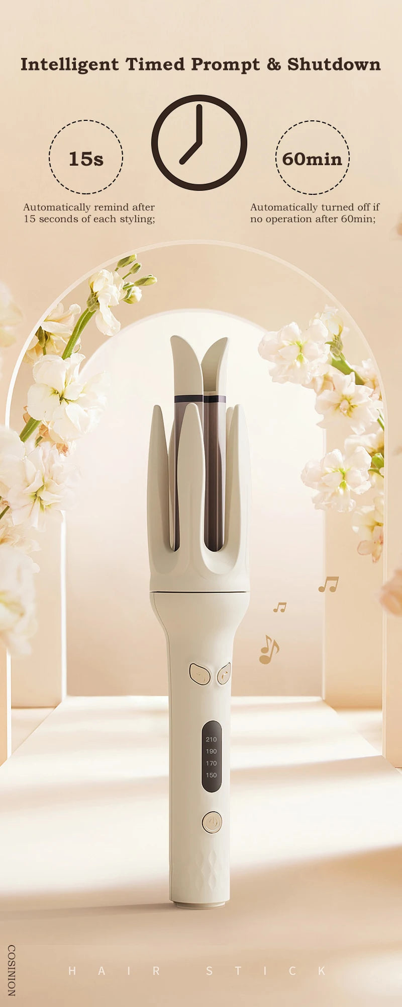 A white automatic ceramic hair curler stands in a soft-lit studio setting with floral accents.