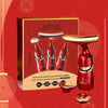 Un set de masaje facial rojo con tres herramientas, mostrado en una caja de color dorado.