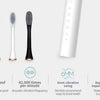 A white sonic electric toothbrush shown alongside its brush head and charging unit with features like waterproof rating and v