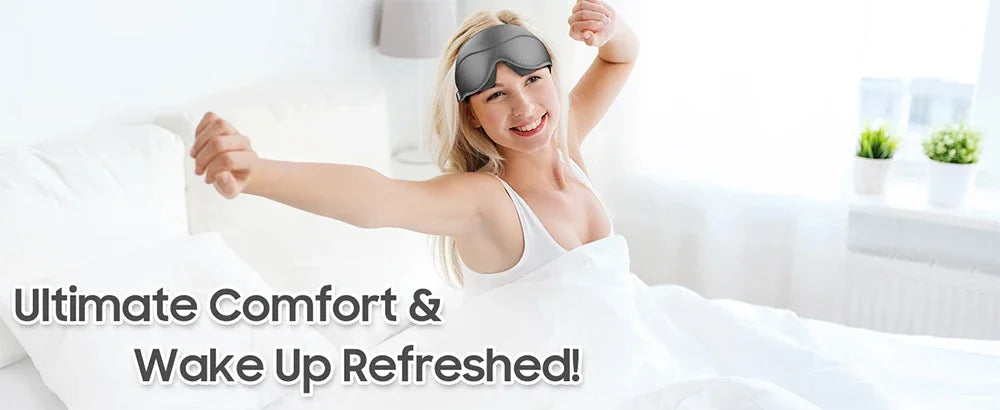 A woman wearing a gray 3D memory foam sleep mask is lying in bed, looking refreshed.