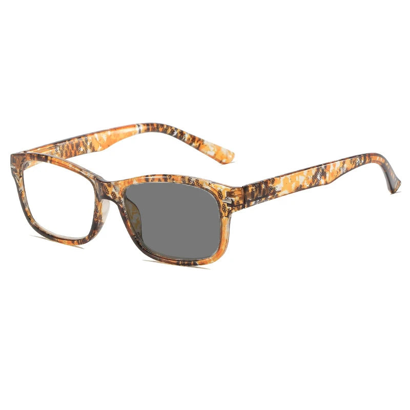 A pair of tortoiseshell photochromic reading glasses with a dark lens.