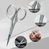 A set of silver beard grooming tools including scissors, a comb, and brush with carved motifs and a moisturizing handle.
