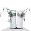 A white portable mesh nebulizer with clear plastic masks is shown from the side.