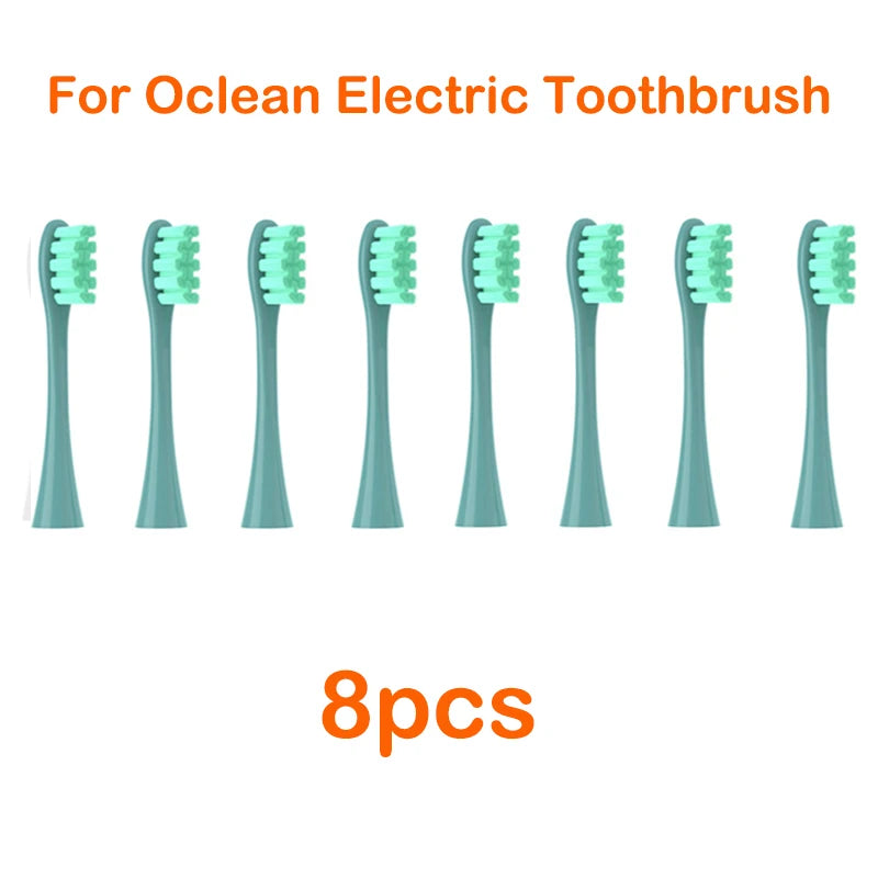 Eight replacement brush heads for an Ocean electric toothbrush, shown lined up.