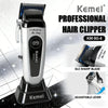 A Kemel professional hair clipper KM-90-4 with a silver body and black base, showing an adjustable lever and DLC sharp blade.