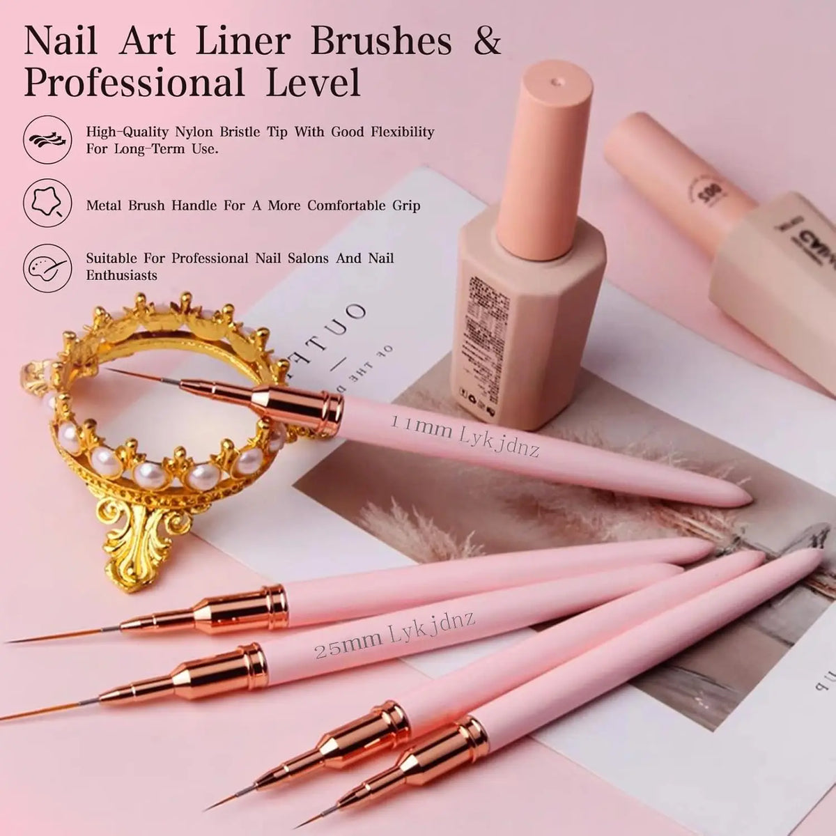 A collection of pink and gold nail art liner brushes, including a metal brush handle and various tips, displayed on a white b