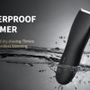 A black waterproof trimmer is shown submerged in water with splashing droplets.