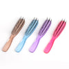 A set of five plastic scalp massage combs in various colors including rose gold, light blue, cyan, purple, and pink.