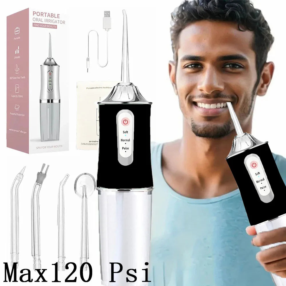 A man is holding a portable oral irrigator device, demonstrating its use for dental cleaning.