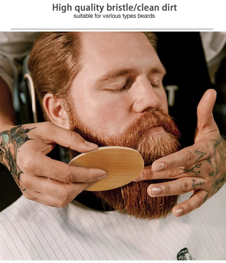 A man is using a wooden boar bristle comb to style his beard and mustache.