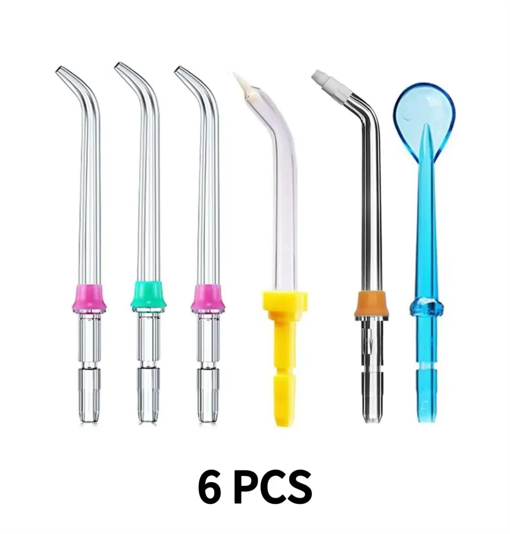 Six replacement tips for water flosser nozzles shown in various clear and colored plastic and metal forms