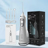 A silver oral irrigator device is shown next to its box and manual.