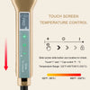 A close-up of a gold-colored hair straightener with a touch screen temperature control display and power button.