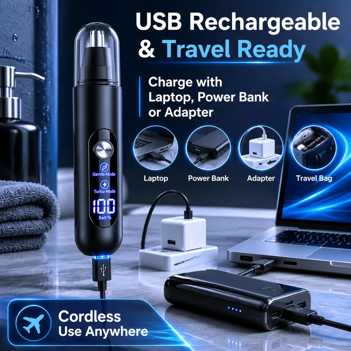 Black USB rechargeable nose and eyebrow hair trimmer shown next to a laptop and power bank.