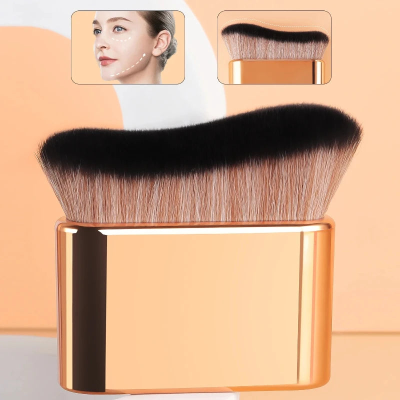 A close-up of a precision hand-held foundation makeup brush with black and gold accents, shown alongside a model's face.