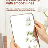 A hand holds a folding cosmetic mirror with round curved edging and smooth lines against a white background.