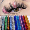 A close-up of an eye featuring natural look brown eyelash clusters in various shades and styles.