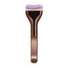 A professional foundation brush with soft purple nylon bristles and a wooden handle.