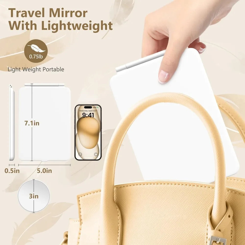 A hand holds a white travel mirror with a light weight, showing its size and portability.